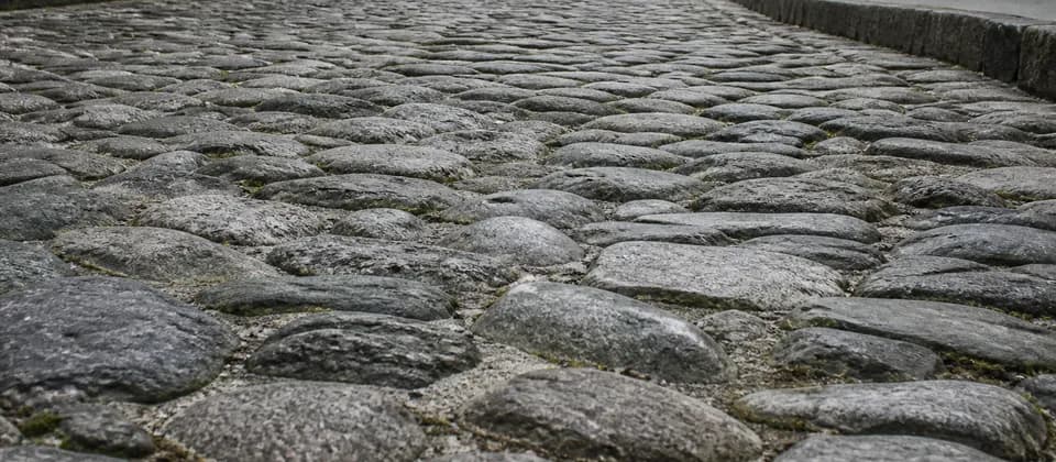 An uneven historic cobblestone surface